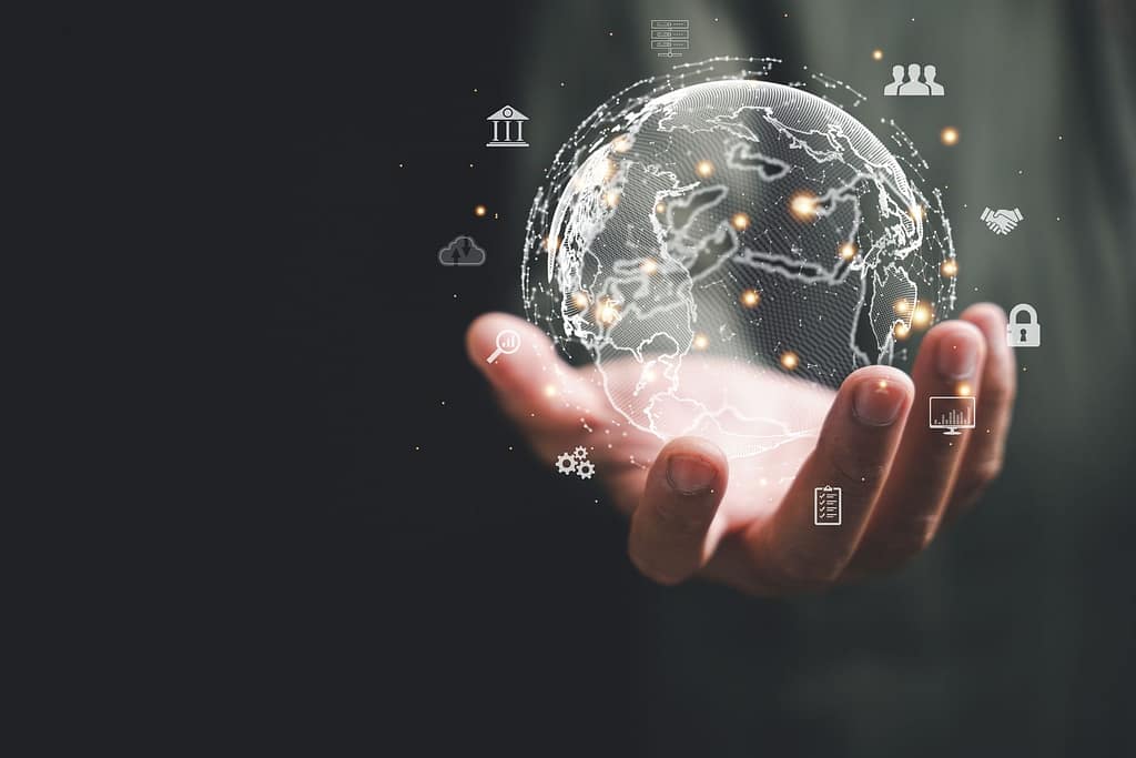 hand grasps a virtual Global Internet connection metaverse Crea tu LLC desde España Optimizacion fiscal 2026